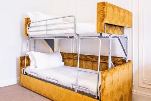 a bunk bed in a room with a bunk bed frame at Astor Court Hotel in London