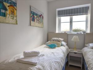 En eller flere senge i et værelse på East Barn