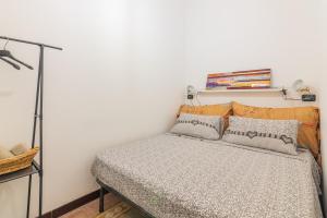 A bed or beds in a room at Casa Pepes centro Ortigia