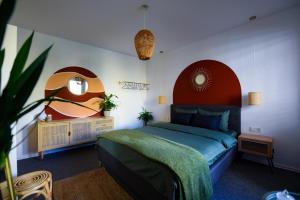 a bedroom with a large bed and a mirror at Sunny & Bright Central in Prishtinë