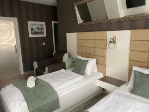 Posteľ alebo postele v izbe v ubytovaní VIP Apartments