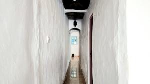 an alley way with white walls and a ceiling at Good Vibes House Imsouane in Imsouane