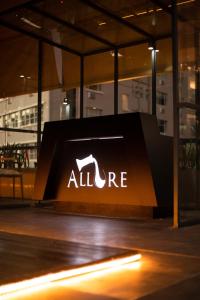a sign with an allire logo on the side of a building at Queen Julie Lodge in Cape Town
