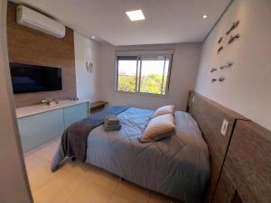 Cama ou camas em um quarto em Cobertura Frente Mar Campeche - 3 quartos, jacuzzi mais 17 fotos