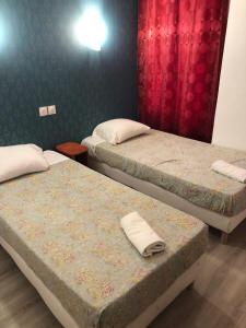 Posteľ alebo postele v izbe v ubytovaní Hôtel Central Bastille
