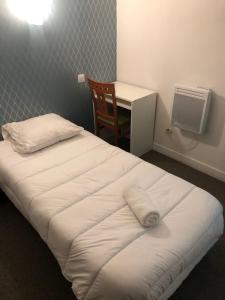 Posteľ alebo postele v izbe v ubytovaní Hôtel Central Bastille