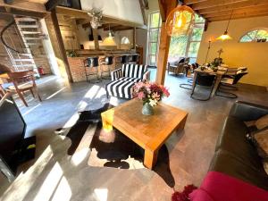 a living room with a couch and a coffee table at Boerderijlodge Kamperland in Kamperland