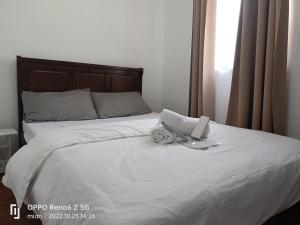Ein Bett oder Betten in einem Zimmer der Unterkunft LJ's transient house Northridge Grove, Bria Homes, Tungkong Mangga, SJDM