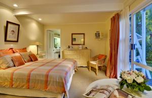 A bed or beds in a room at The Peppertree Luxury Accommodation