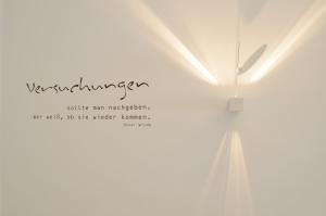 a white clock on a white wall with the words networking at Puro-Design-Apartment Deluxe - very central in Munich