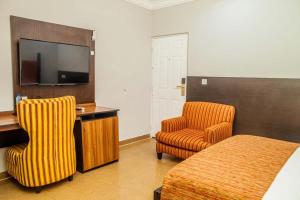 TV a/nebo společenská místnost v ubytování Hotel 61