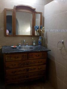 a bathroom with a sink and a mirror at Casa quinta en Mercedes, Bs As in Mercedes