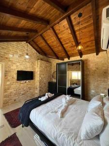 Postel nebo postele na pokoji v ubytování Al baidar zimmer