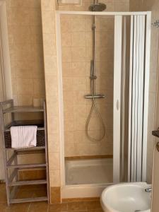 a bathroom with a shower and a sink at Casa del Sole in Foggia