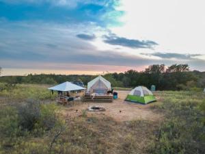 two tents in the middle of a field at Tentrr Signature Site - Texas 1873 in May