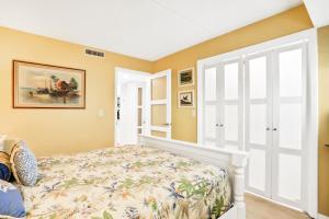 a bedroom with a bed and a window at Life is But a Dream in Jacksonville Beach