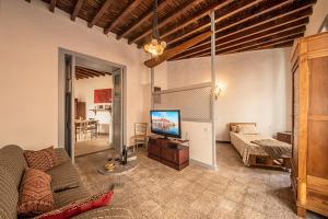 A television and/or entertainment centre at Mi casa es tu casa