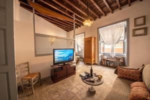 A television and/or entertainment centre at Mi casa es tu casa