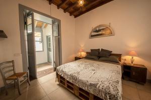 A bed or beds in a room at Mi casa es tu casa