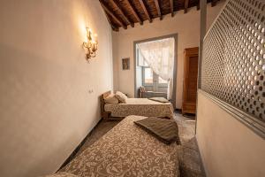 A bed or beds in a room at Mi casa es tu casa