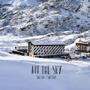 a building in the snow with the words hit the sky at Hit the Sky in Sankt Christoph am Arlberg