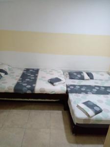 Postel nebo postele na pokoji v ubytování montecarlos hotel