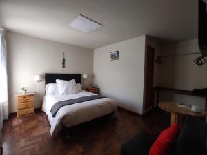 Ein Bett oder Betten in einem Zimmer der Unterkunft Runcu Arequipa