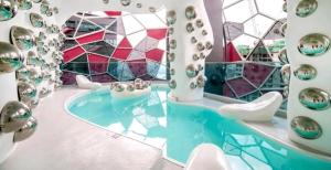 a room with a tub with a glass wall at Arte Plus AMPANG by Zzzayn in Batu Empat