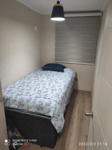 Tempat tidur dalam kamar di DEPARTAMENTO VILLARRICA 2