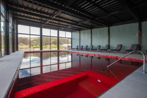 a large pool with a red tub in a building at Hotel Boutique BC Wine Casablanca in Casablanca