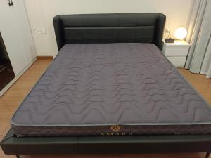 a mattress on a bed frame in a room at Full House - The Matrix One in Hanoi