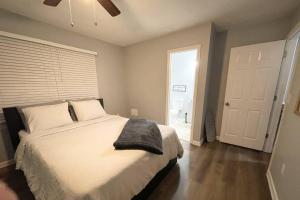 a bedroom with a bed with a black pillow on it at Stone Mountain's Hidden Secret in Stone Mountain