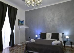Postel nebo postele na pokoji v ubytování Frizzo House
