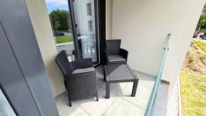 Χώρος καθιστικού στο Perłowe Apartamenty Kołobrzeg +1 φωτογραφίες