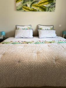 Postel nebo postele na pokoji v ubytování Meherio - Bel Appartement vue mer à TAHITI