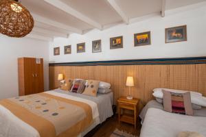 Postel nebo postele na pokoji v ubytování Hotel Pat'ta Hoiri