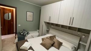 Posteľ alebo postele v izbe v ubytovaní Green Apartment and Pools + 14 fotografií