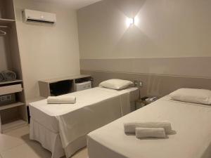 Postel nebo postele na pokoji v ubytování Uno Hotel