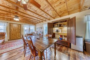 a dining room with a wooden table and chairs at The Studio @ Durst Haus in Fredericksburg