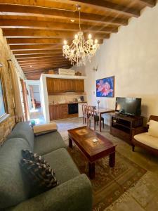 a living room with a couch and a table at Niki's House in Limassol