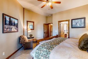 a bedroom with a bed and a ceiling fan at BOTHR Steelhead in McCall