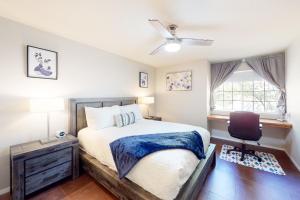 a bedroom with a bed and a ceiling fan at Five Oaks Circle Ranch in Oakhurst