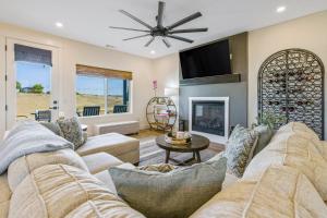 a living room with a couch and a fireplace at Light on the Hill in Paso Robles