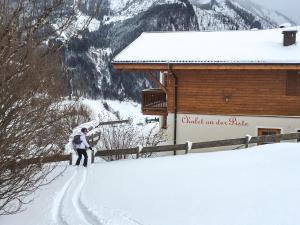 Chalet an der Piste v zime