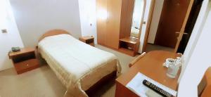 Postel nebo postele na pokoji v ubytování Hotel Kanet