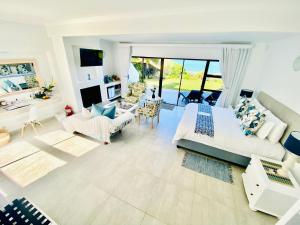 a large living room with a couch and a table at My-konos in St Francis Bay