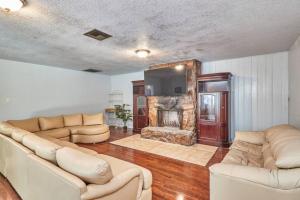 a living room with two couches and a fireplace at Large Groups Up to 12 Guests In ground POOL in Tampa