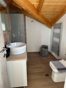 a bathroom with a sink and a toilet at Villa Argyro in Lixouri