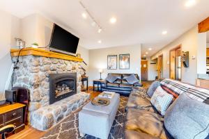 a living room with a couch and a fireplace at Mountain View Home in Bartlett