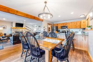 a kitchen and dining room with a wooden table and chairs at Mountain View Home in Bartlett